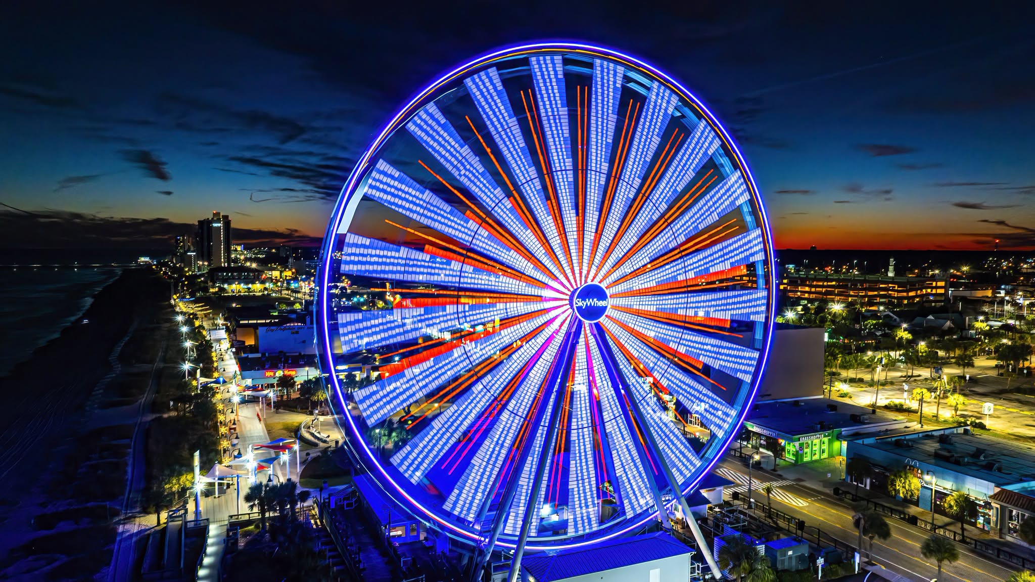 SkyWheel lit up with blue and red lights